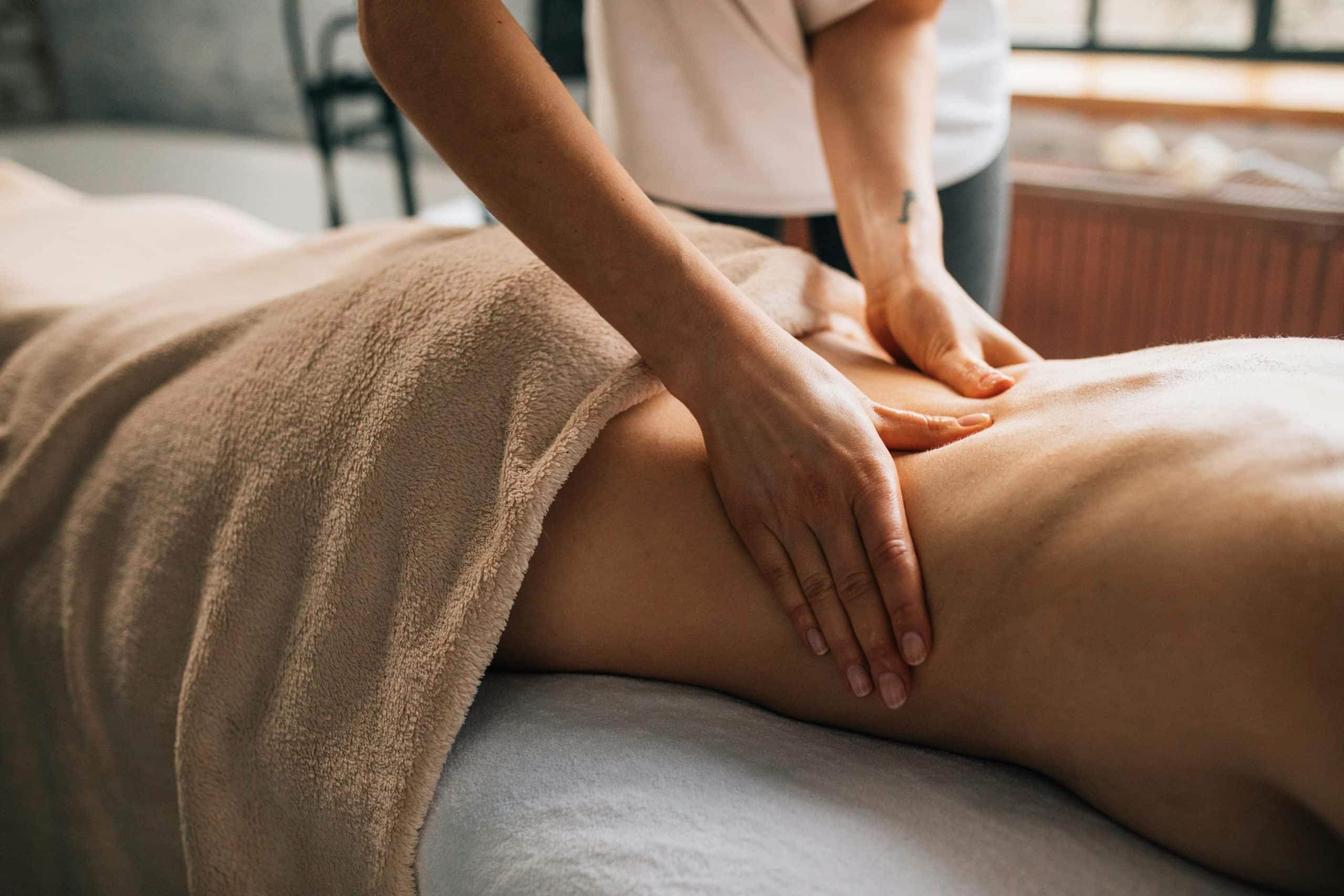 Close-up of therapist giving a soothing massage, capturing relaxation.